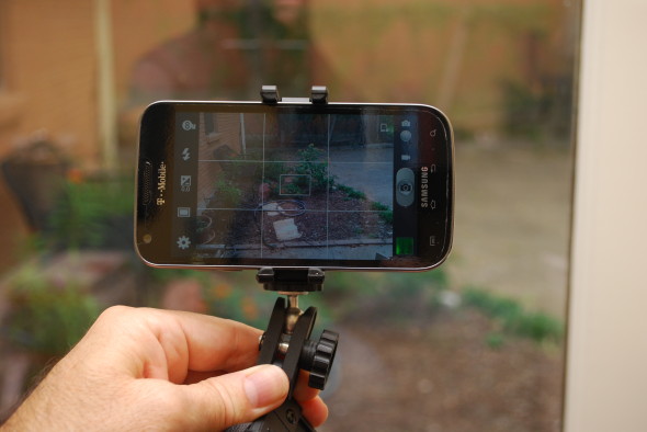 Photographer-facing view of the Joby mount in action. All you can see of it here are the bottom and top arms, that hold the camera.